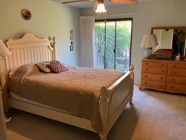 carpeted bedroom featuring ceiling fan