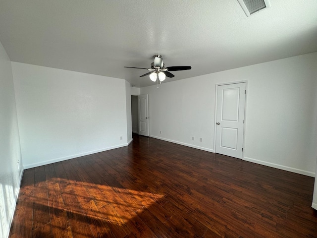 spare room with ceiling fan, dark hardwood / wood-style flooring, and a textured ceiling