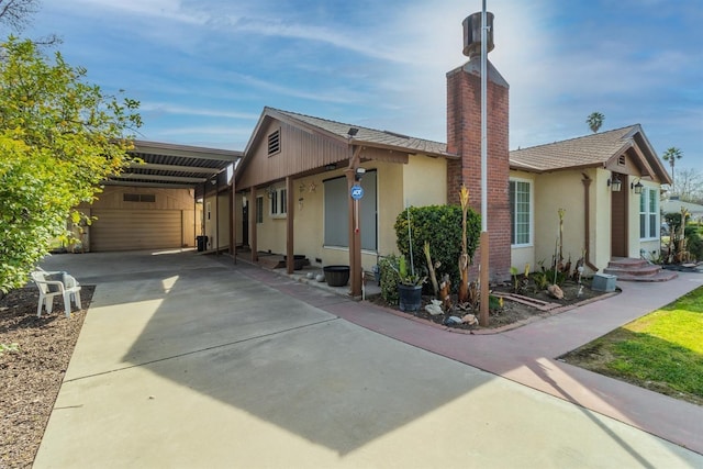 exterior space featuring a carport