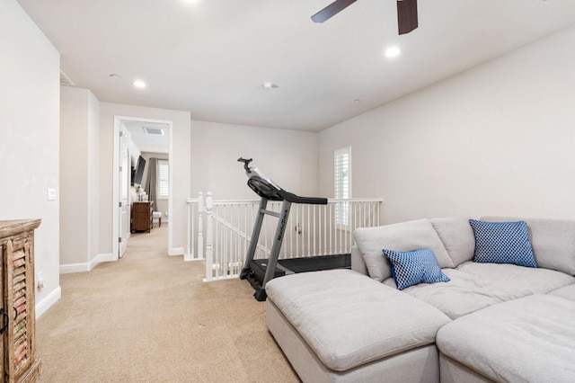 living area with light carpet, baseboards, a ceiling fan, and recessed lighting