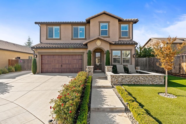 mediterranean / spanish house with a garage, fence, a tiled roof, and stucco siding