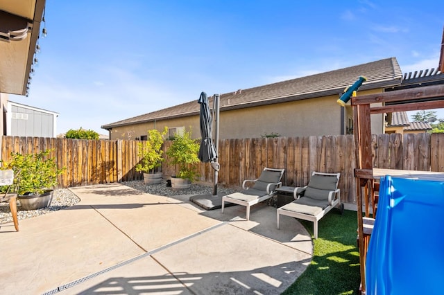 view of patio with a fenced backyard