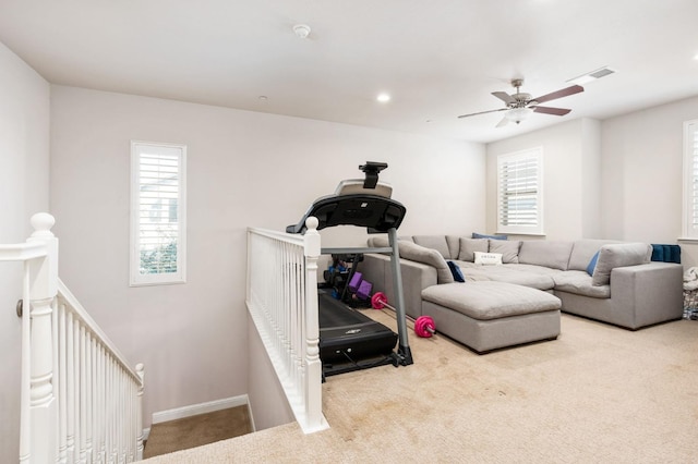 exercise area featuring carpet floors, recessed lighting, visible vents, and baseboards