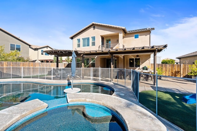 back of property featuring a fenced in pool, a patio, stucco siding, fence, and an in ground hot tub