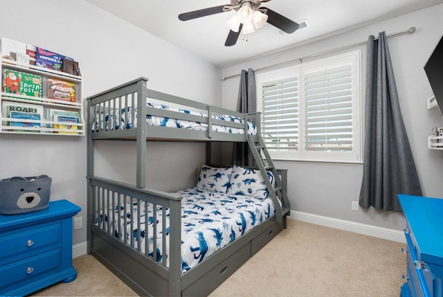 bedroom with carpet flooring, a ceiling fan, and baseboards