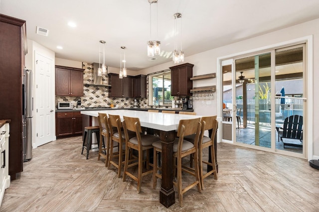 dining area with a ceiling fan, recessed lighting, and visible vents