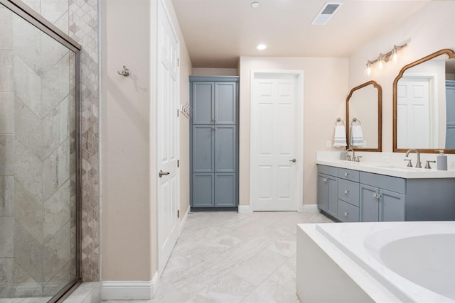 full bathroom with double vanity, a stall shower, visible vents, and baseboards