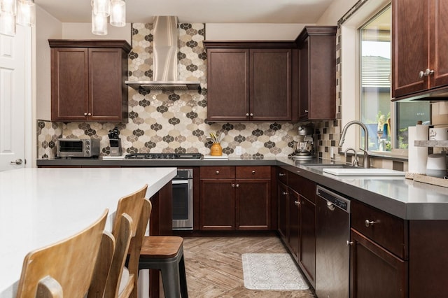 kitchen with dark brown cabinetry, a sink, appliances with stainless steel finishes, wall chimney exhaust hood, and tasteful backsplash