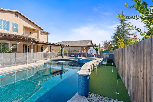 view of pool with a patio area, a fenced backyard, and a pool with connected hot tub