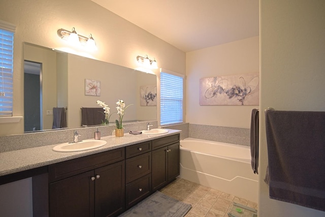 bathroom with a bathtub and vanity