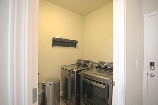 laundry room with washer and dryer