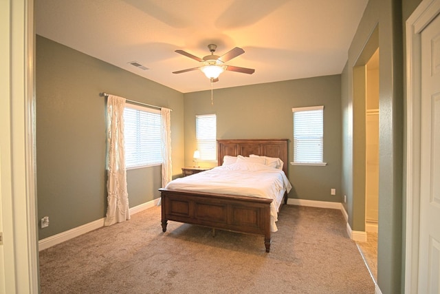 bedroom featuring light colored carpet and ceiling fan