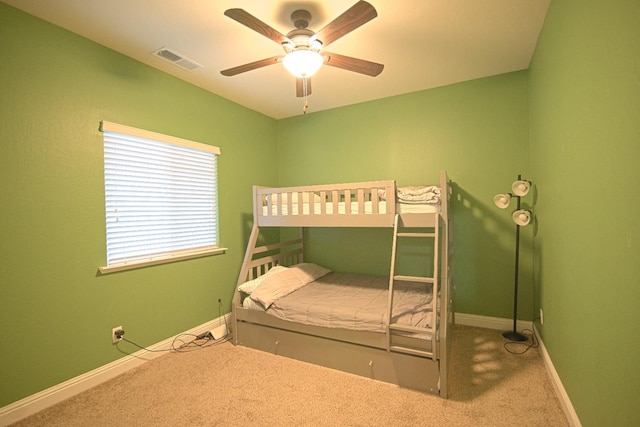 unfurnished bedroom featuring carpet and ceiling fan