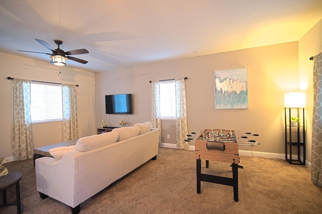 carpeted living room featuring ceiling fan