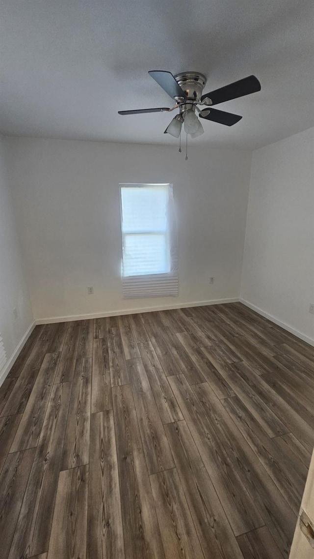 spare room featuring a textured ceiling, dark hardwood / wood-style flooring, and ceiling fan