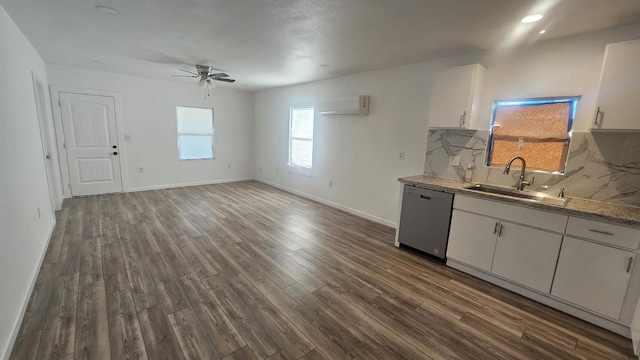 kitchen with white cabinets, tasteful backsplash, sink, dishwasher, and dark hardwood / wood-style floors