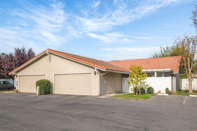 single story home featuring a garage