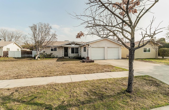 single story home featuring a front yard and a garage