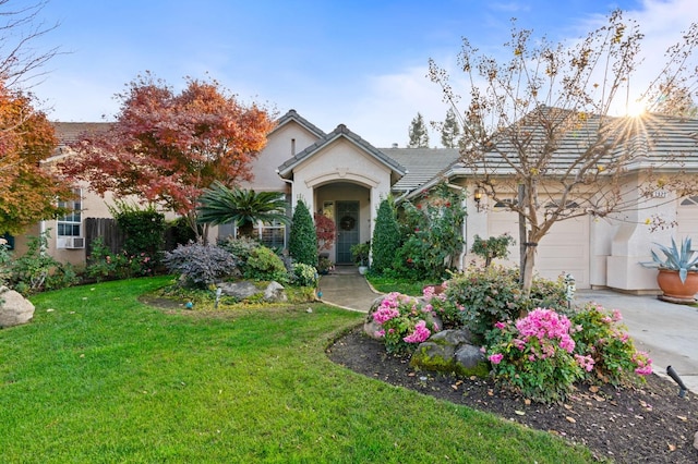 view of front facade featuring a front lawn and a garage