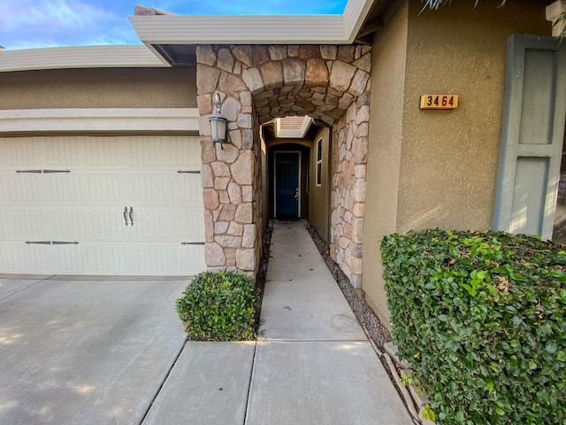 entrance to property featuring a garage