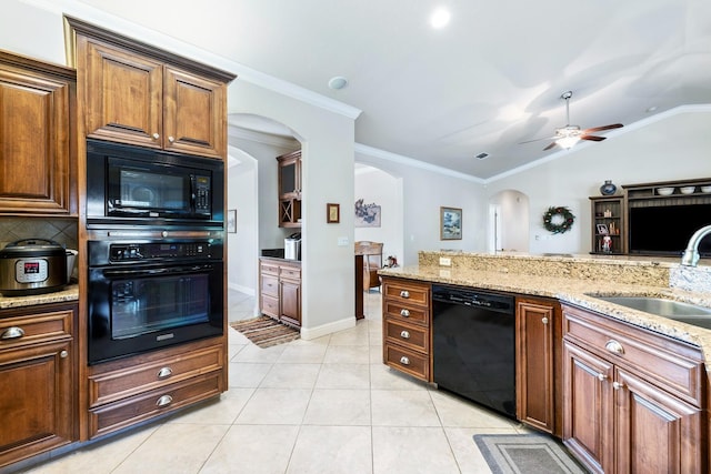 kitchen featuring ceiling fan, lofted ceiling, ornamental molding, black appliances, and sink