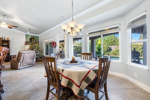 tiled dining room featuring ceiling fan with notable chandelier and ornamental molding