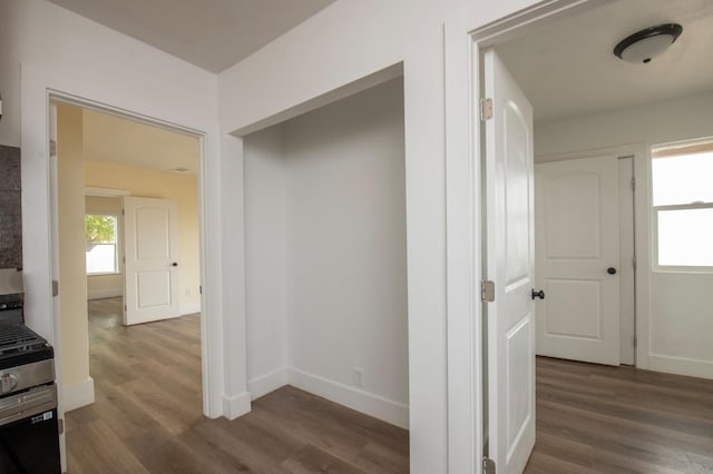 hall with dark wood-type flooring