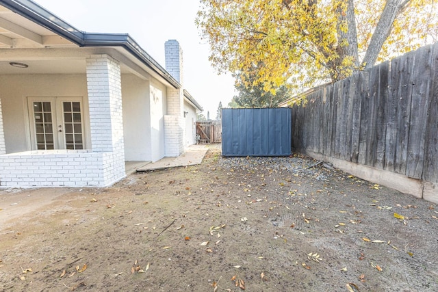 view of yard featuring french doors