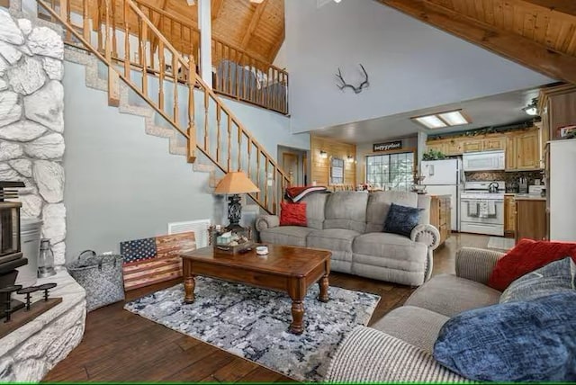 living room with beamed ceiling, high vaulted ceiling, wood ceiling, and dark hardwood / wood-style floors