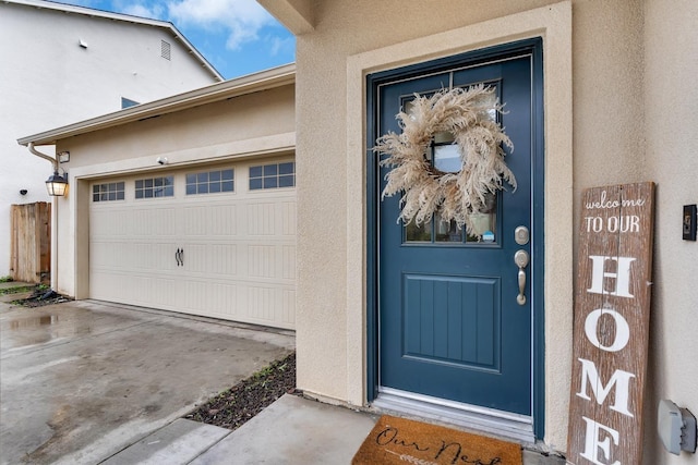 doorway to property featuring a garage