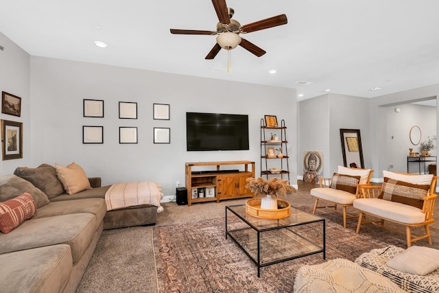 living room featuring carpet floors and ceiling fan