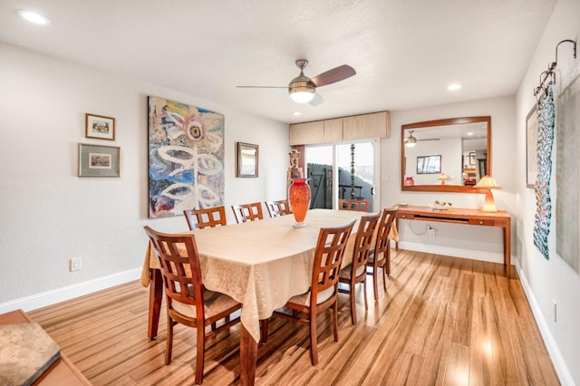 dining room featuring ceiling fan and light wood-type flooring