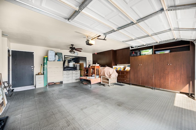 garage featuring a garage door opener and ceiling fan