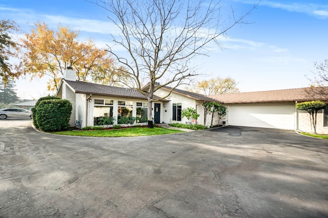 single story home featuring a garage