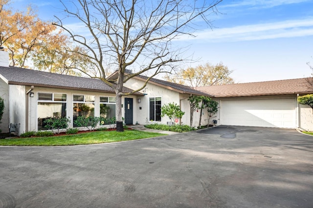 single story home featuring a garage