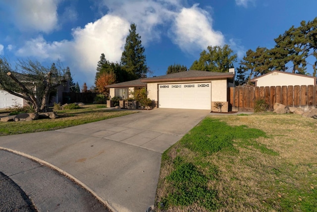 ranch-style home with a garage and a front yard