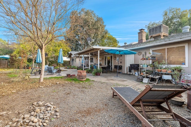 exterior space with a patio and central AC unit