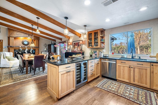 kitchen featuring sink, hanging light fixtures, stainless steel dishwasher, dark hardwood / wood-style floors, and beverage cooler