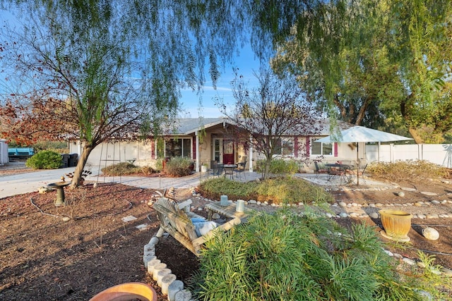 ranch-style home featuring a patio