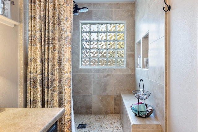 bathroom with a shower with curtain and vanity