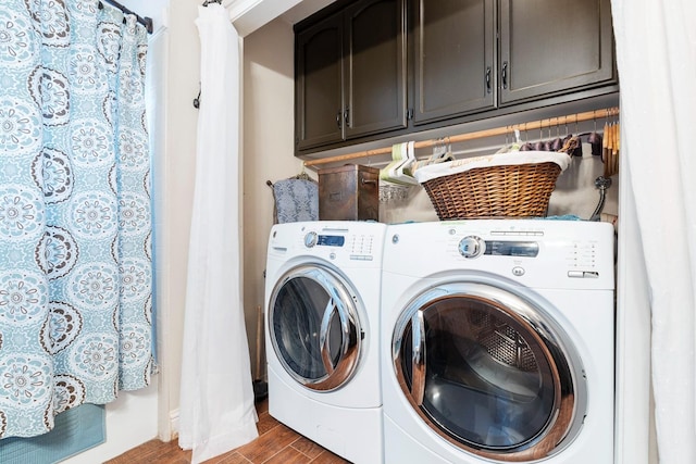 clothes washing area featuring hardwood / wood-style flooring and separate washer and dryer