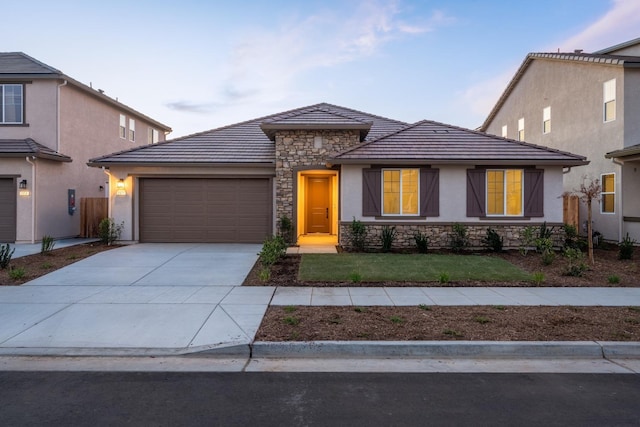 view of front of house featuring a front yard and a garage