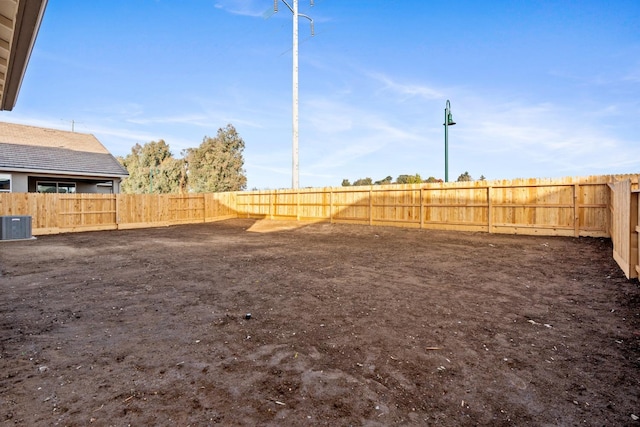 view of yard featuring central air condition unit