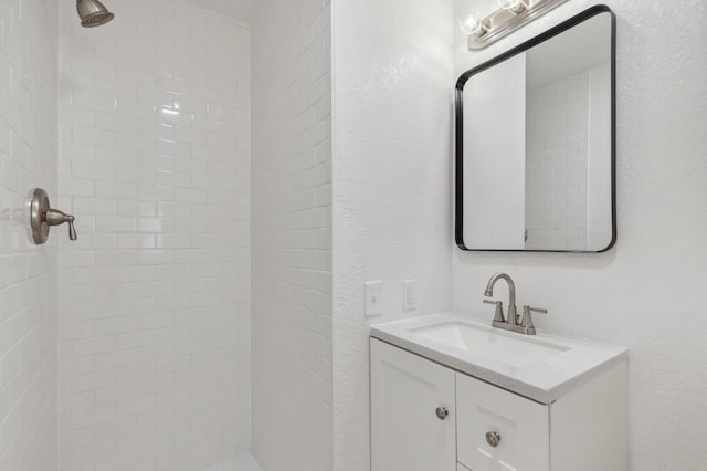 4756 E Woodward Ave, Fresno, CA 93702 - full bathroom featuring a tile shower and vanity