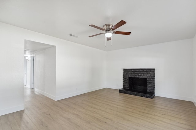 4756 E Woodward Ave, Fresno, CA 93702 - unfurnished living room featuring light wood finished floors, visible vents, baseboards, and ceiling fan
