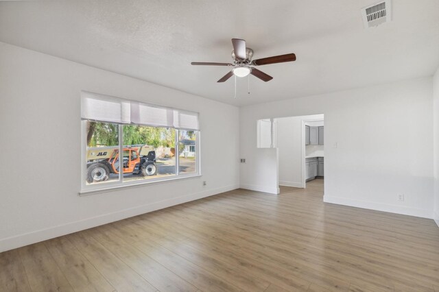 interior space featuring light wood-type flooring and ceiling fan