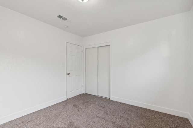 spare room featuring carpet flooring