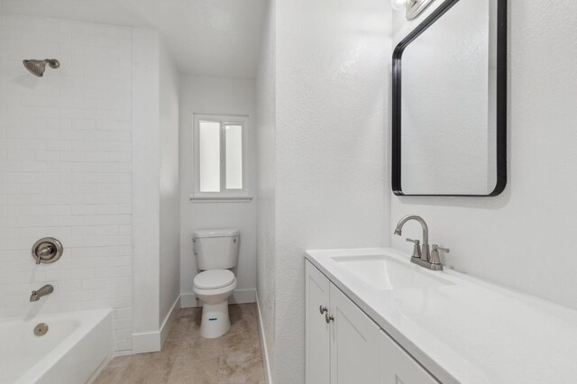 full bathroom featuring tile patterned floors, vanity, toilet, and tiled shower / bath