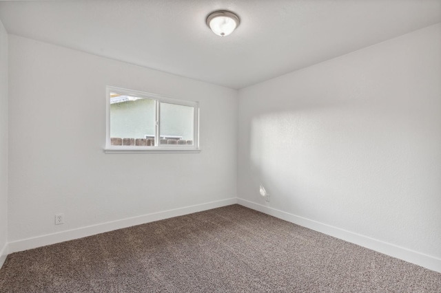 4756 E Woodward Ave, Fresno, CA 93702 - carpeted empty room with baseboards