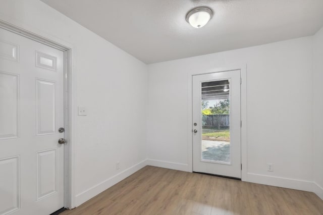 4756 E Woodward Ave, Fresno, CA 93702 - doorway to outside with light wood finished floors and baseboards